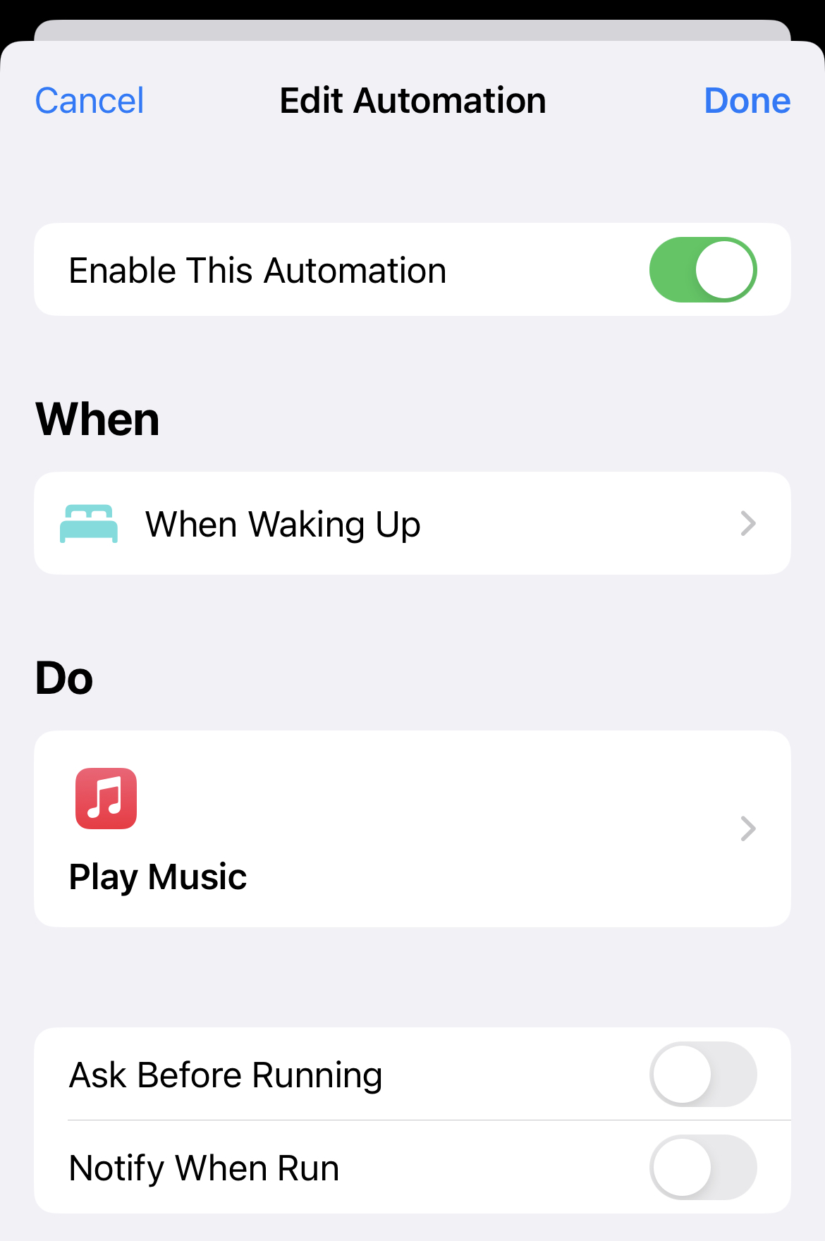 Screenshot of the shortcuts app showing an automation triggered by waking up that starts a music action.